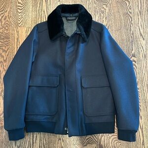 Navy bomber removable faux fur collar. Made with Loro Piana storm system lining.